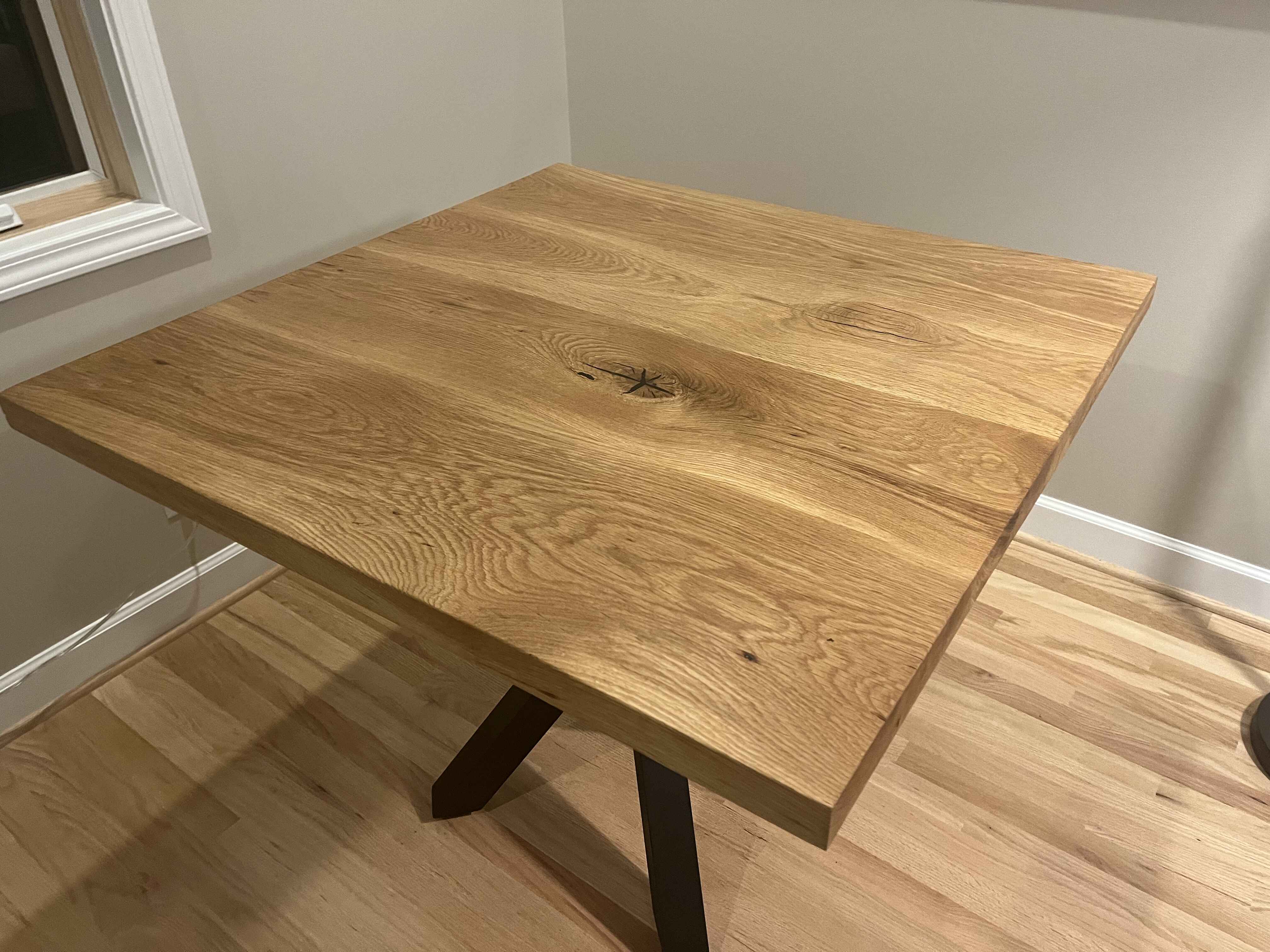 White oak table with black metal legs